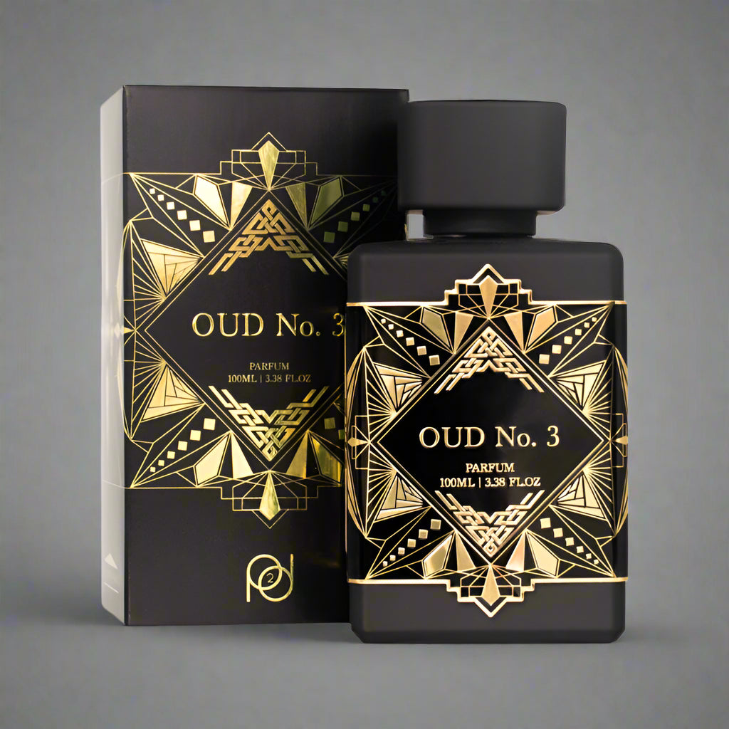Black and gold OUD No. 3 perfume bottle and packaging on a gray background